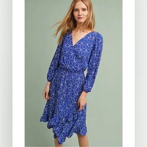 Elegant Blue Patterned Dress with flirty handkerchief hem.